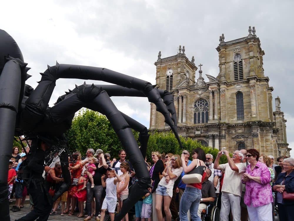 Arachnobot the giant spider puppet surrounded by a crowd
