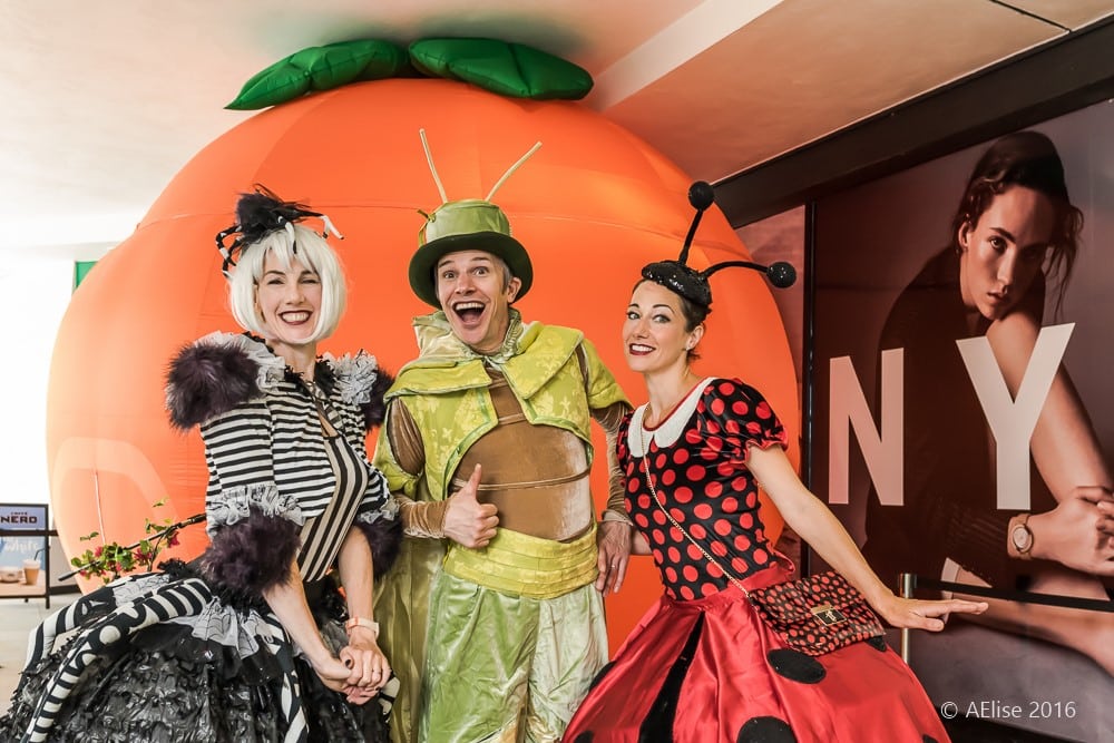 characters from Mr Chirrup’s Curious Bug Safari in front of an inflatable giant peach