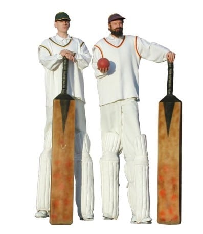 stilt walkers as two batsmen with outsized bats and ball