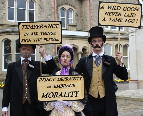 characters from The Temperance Society holding plaquards
