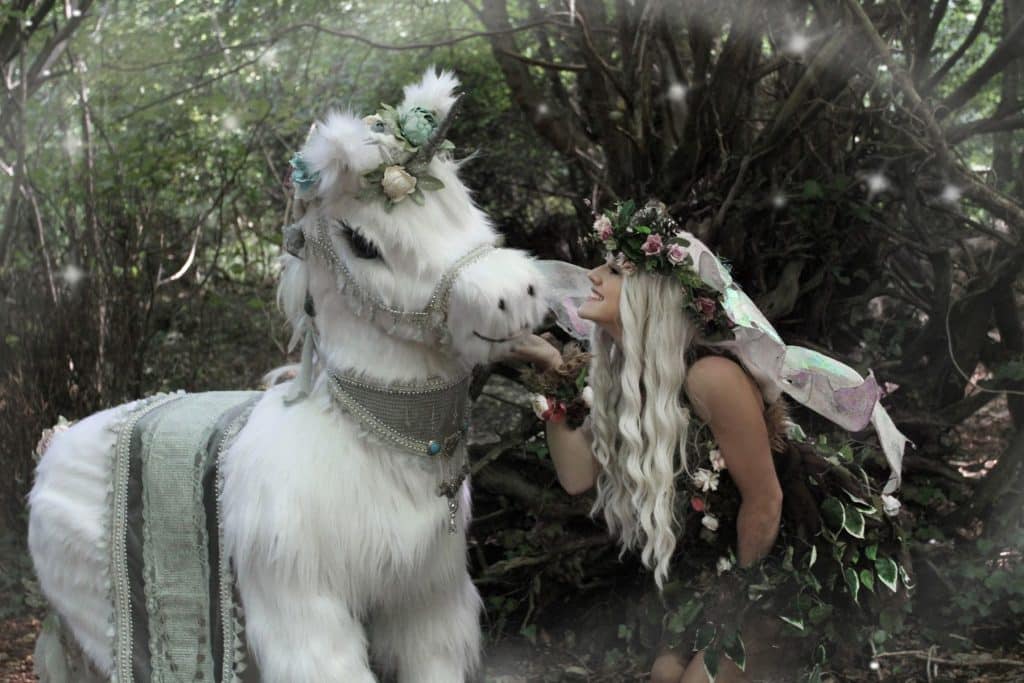 Animatronic Fantasy World Entertainment unicorn with woodland fairy