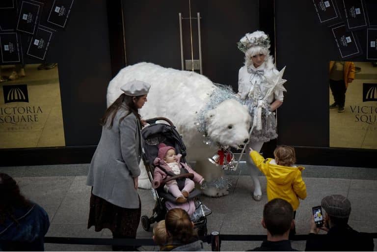 Animatronic polar bear with young child