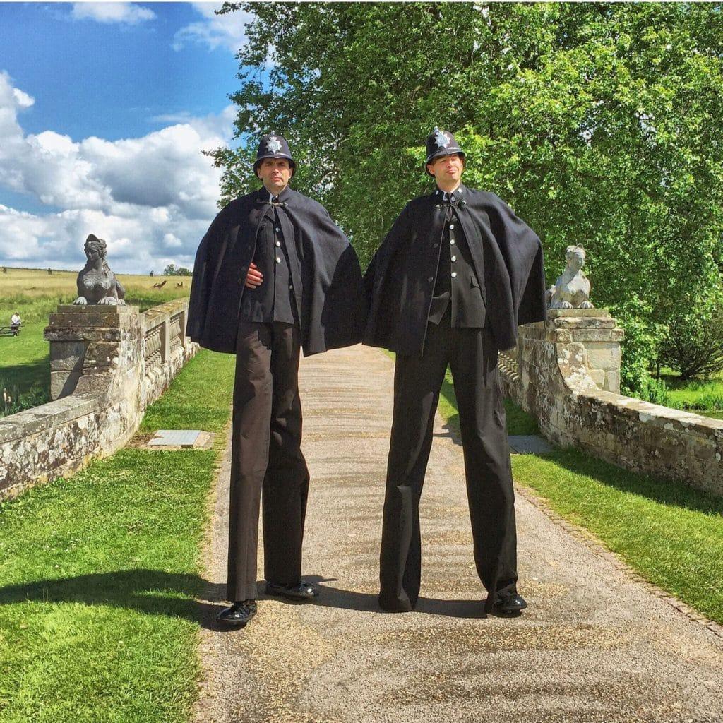 stilt walkers dressed as Victorian Policemen